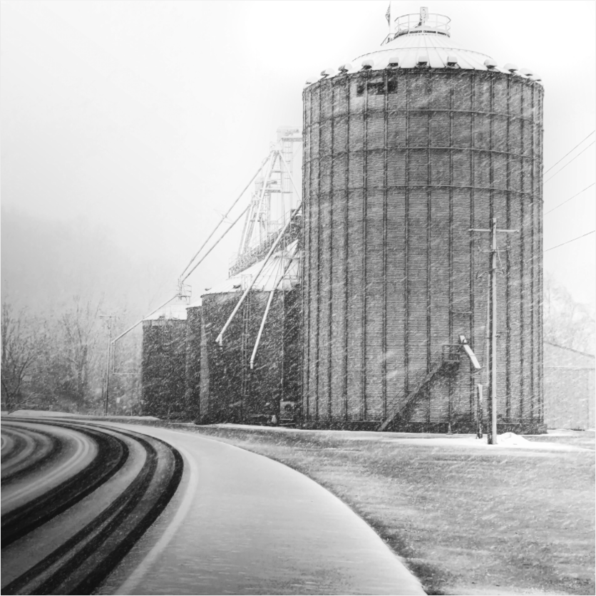 Black and white fine art photograph of a harvested field—minimalist composition focused on surface, texture, and visual calm.
